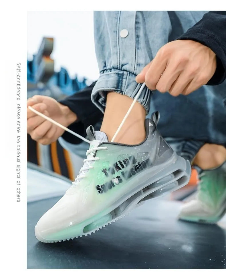 Men's black and green heightened platform sneakers with mesh upper and round toe on a rubber sole.