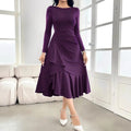 Purple women's long sleeve dress with round neck, ruffles, and mid-waist design on hanger