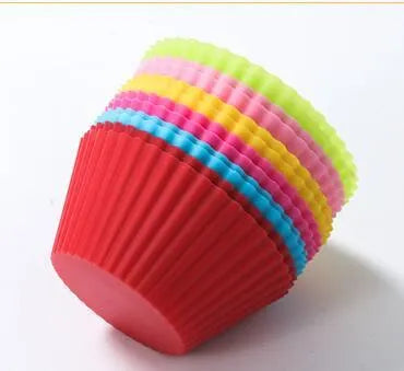 12 nonstick reusable silicone cupcake liners in six colours arranged for baking