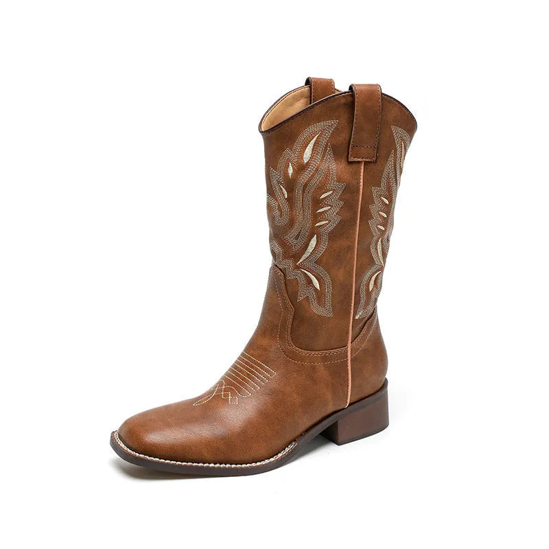 Brown women's Martin boots with embroidered toe cap and mid-calf height.
