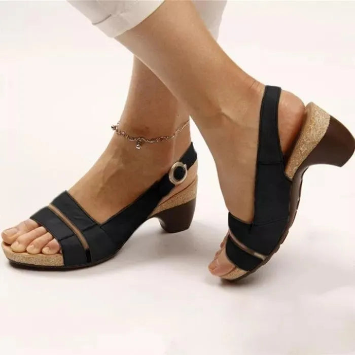 Women's ankle strap sandals in low heel peep toe style with buckle fastening, synthetic leather upper, multiple colours available