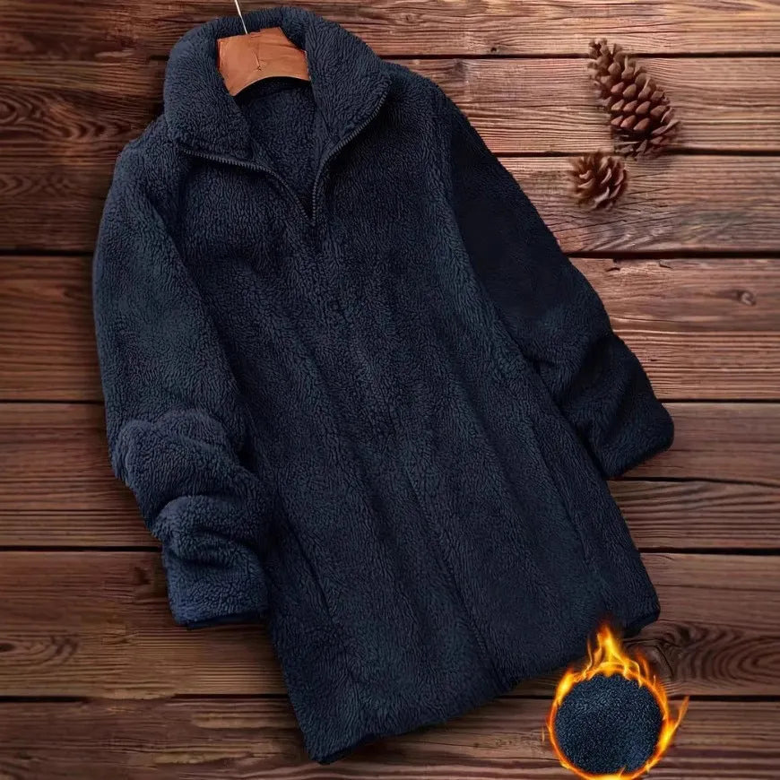 Man wearing a black double-sided fleece jacket outdoors, showing soft texture.