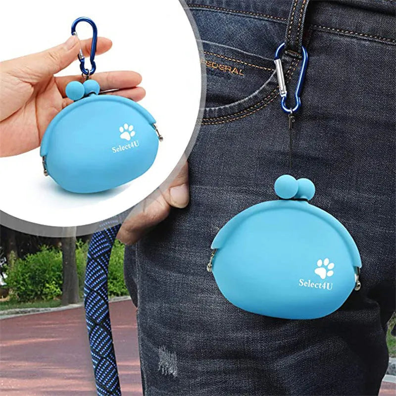 Yellow silicone dog treat pouch with hook and loop strap, shown on a waistband.