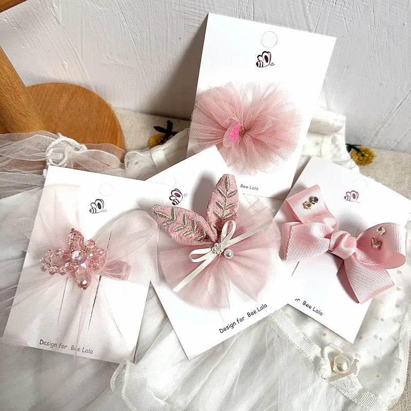 Children's press clip hair accessories set with cloth bows, sequins, pearls, and crystal flowers in pink and beige