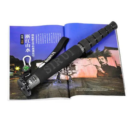 Black carbon fibre monopod for DSLR cameras extended to full height with camera mount visible