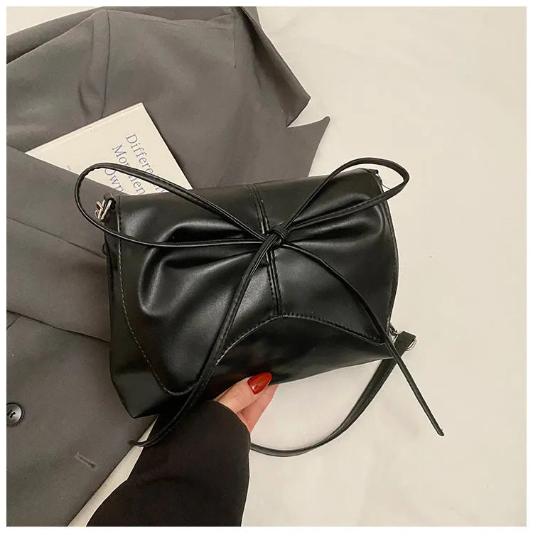 Women's underarm crossbody bag in horizontal square shape with sandwich pocket design and crossbody strap