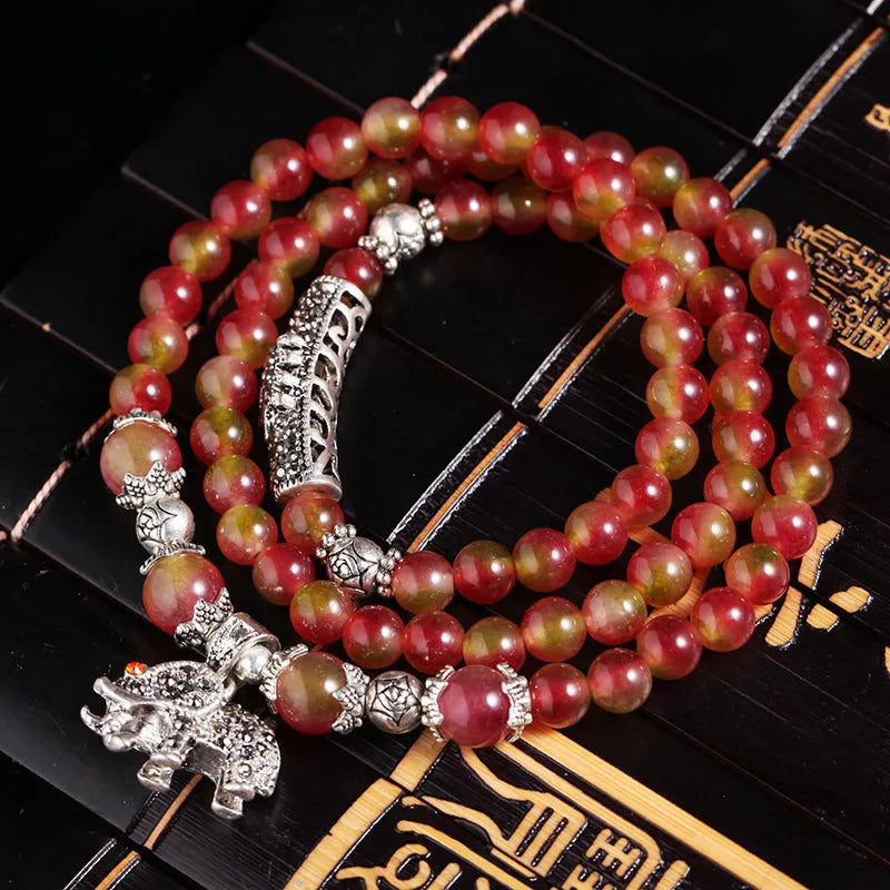 Handmade natural watermelon crystal bracelet with Chinese knot fastening and geometric beads