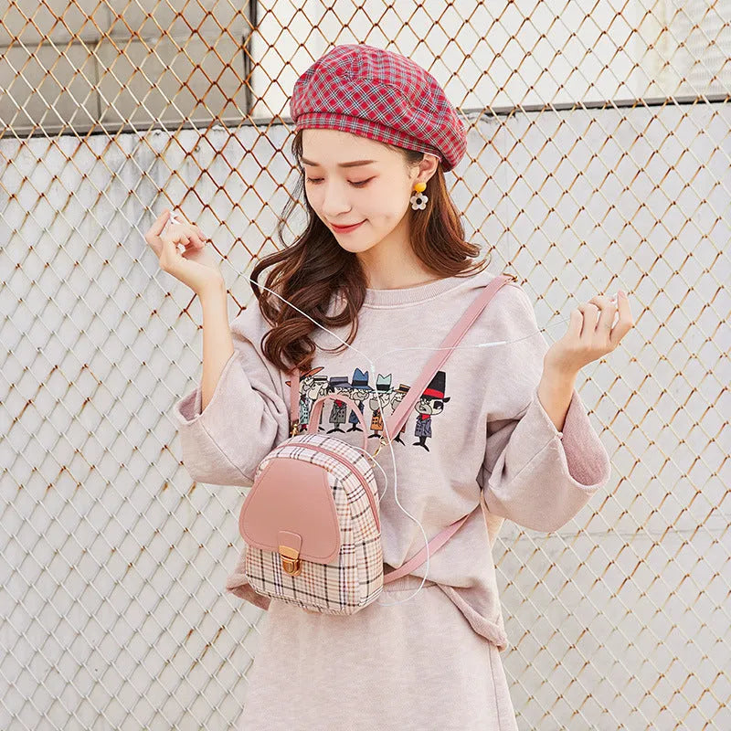 One shoulder diagonal phone bag in PU material, shown in a choice of black, blue, brown, pink, or red.