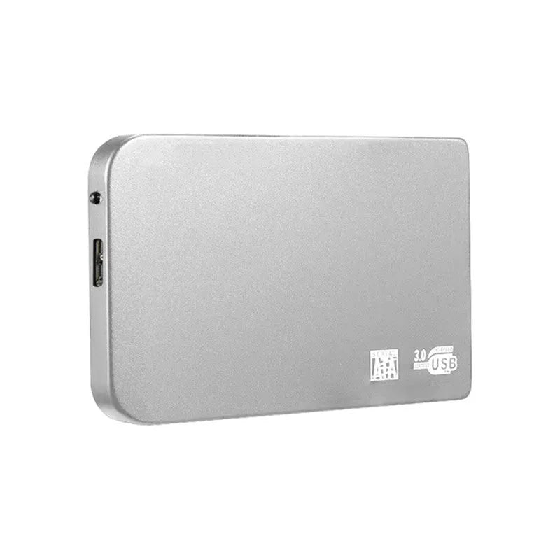 Silver metal external solid state drive with USB 3.0 cable on a desk.