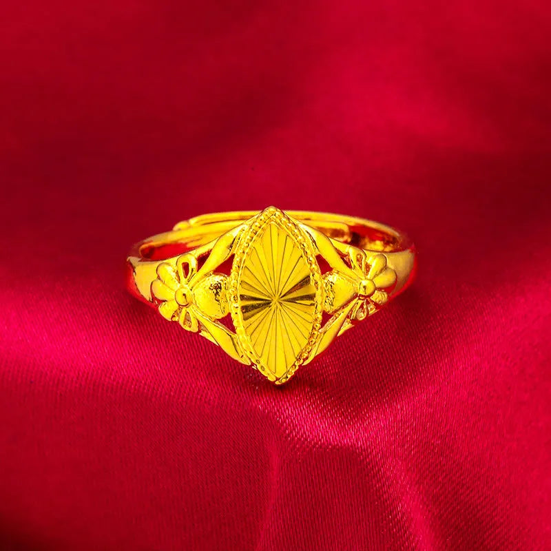 Gold electroplated brass ring with geometric open diamond flower design and textured surface