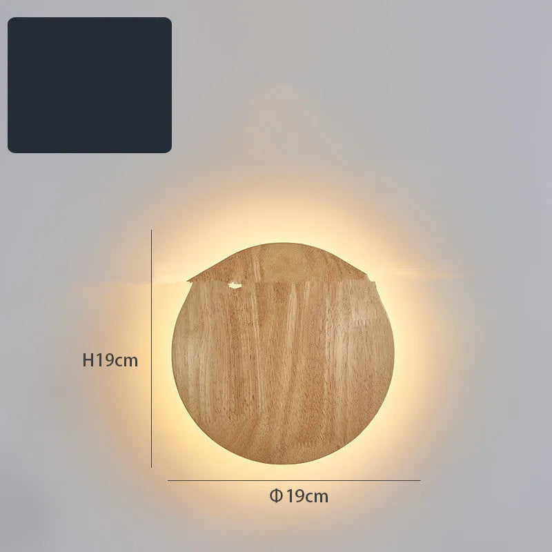 Log Art wood LED wall lamp with oval shape and warm light on a white wall