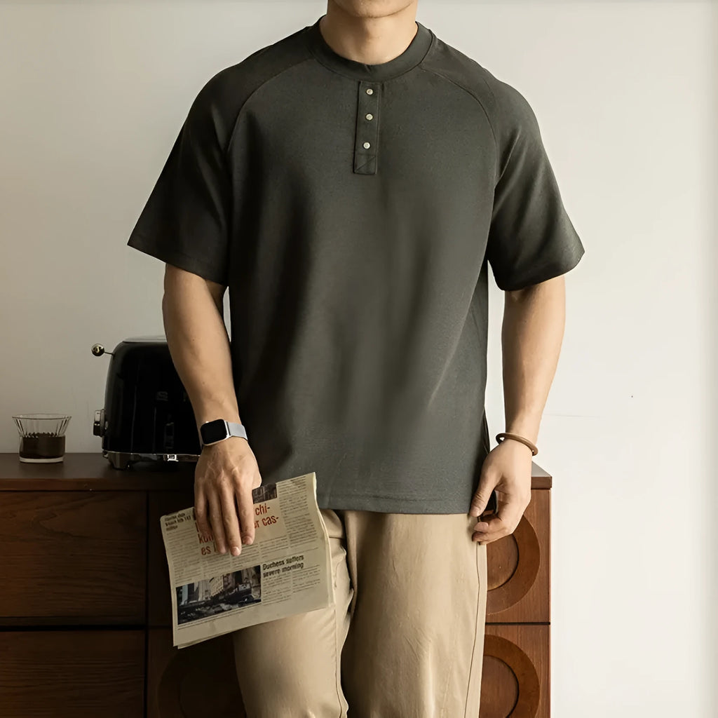 Casual loose top with raglan sleeves in terry texture fabric available in smoky grey, white, and black colours