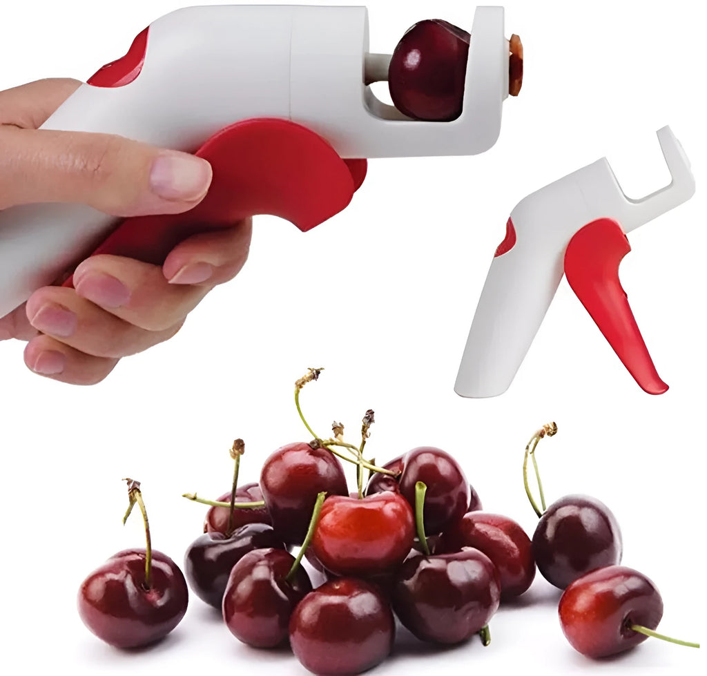 Close-up of a handheld cherry pitter with a plastic handle and stainless steel pitting mechanism