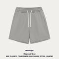 Children's loose-fit denim shorts in charcoal grey on a hanger