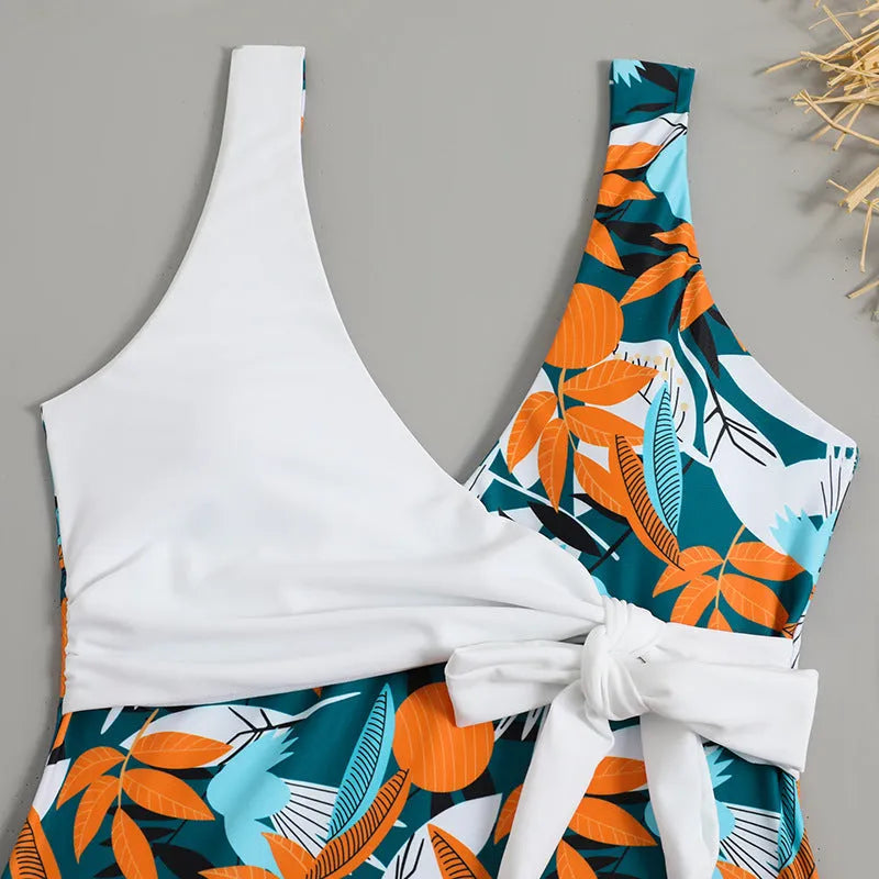 Women's high-waist one-piece swimsuit with an all-over printed pattern in a conservative style.