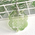 Acrylic four-leaf clover keychain pendant in blue, green, or mint colour options.