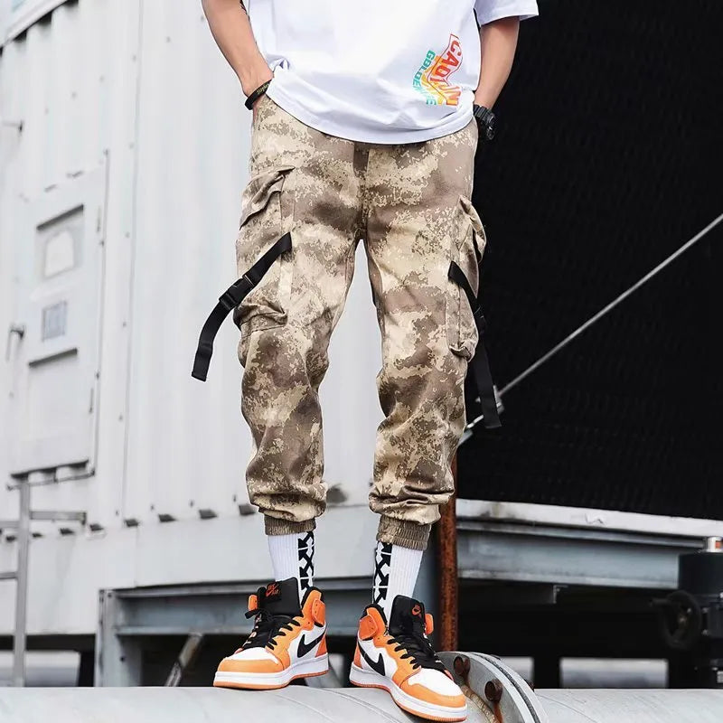 Hip hop jogger pants in khaki cotton fabric with elastic cuffs, shown flat