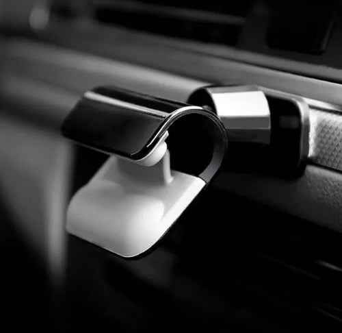 Black universal car phone holder showing 360-degree rotating bracket with 3M adhesive backing
