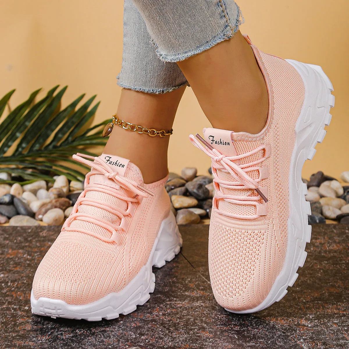 Women's low-top sports shoes with mesh upper and white sole in multiple colours.