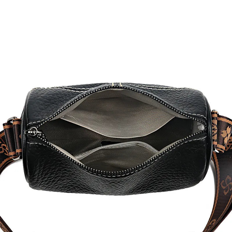 Women's casual stitched genuine leather shoulder bag in cylindrical shape, available in black, brown, green, and white