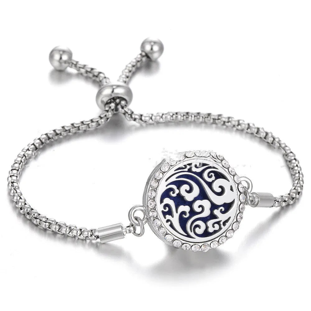 Hollow stainless steel adjustable aromatherapy bracelet with 20mm box diameter and electroplated alloy finish on white background