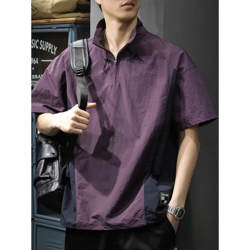 Brown men's casual half-zip short-sleeve shirt with a stand collar, showing the fleece-lined interior and loose fit.