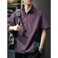 Brown men's casual half-zip short-sleeve shirt with a stand collar, showing the fleece-lined interior and loose fit.