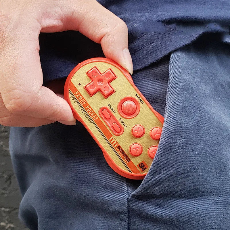 Mini handheld video game console with 20 built-in NES games, shown in black, measuring 85x45x15mm with AV output cable