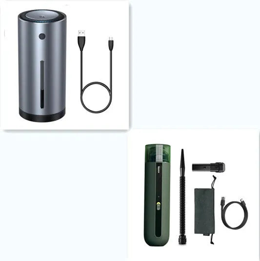 Black cordless handheld car vacuum cleaner with blowing hose attachment on a desktop.