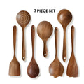 Seven-piece wooden kitchen utensil set containing a large spoon, spatula, and soup ladle.