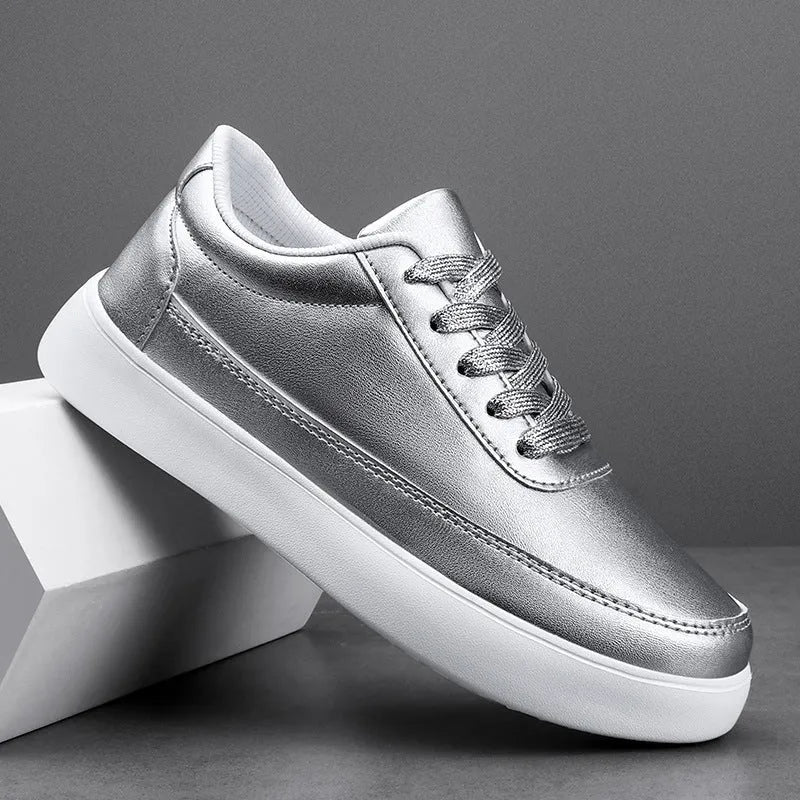 Women's white leather lace-up flat casual shoes on a solid background.
