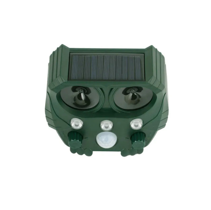 Green solar-powered ultrasonic dog repeller unit for outdoor garden protection
