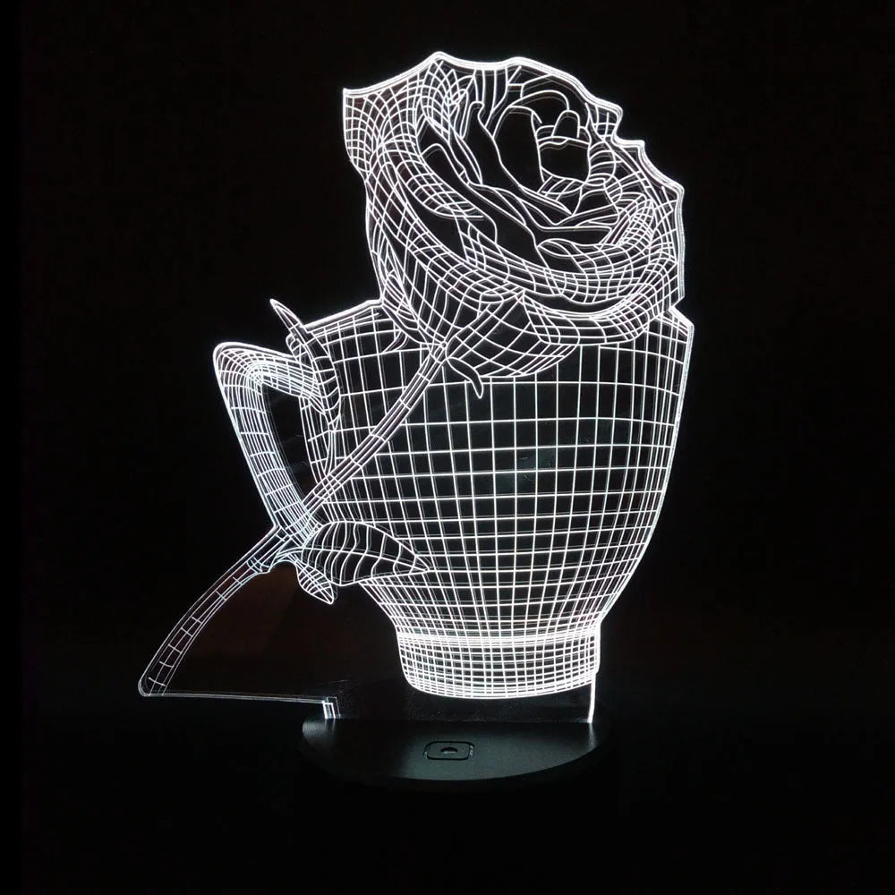 3D acrylic rose flower night light in black finish on a table, showing multicoloured LED illumination.