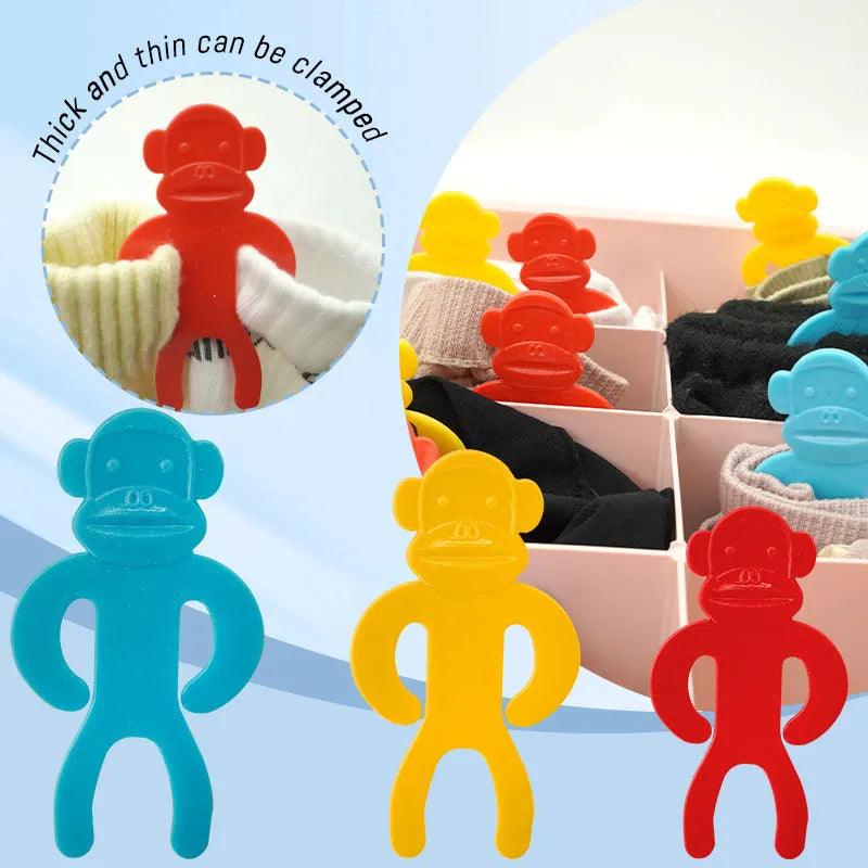 Plastic socks storage clips in blue, red, and yellow colours showing anti-winding laundry organisation