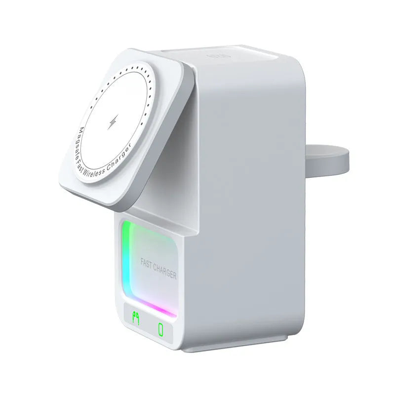 White and black Bluetooth speaker wireless charger with phone mounted magnetically.