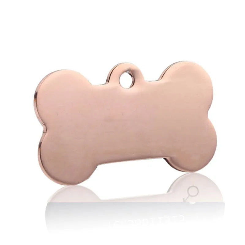 Small pendant stainless steel pet ID tag with custom laser engraving in bone shape on a collar