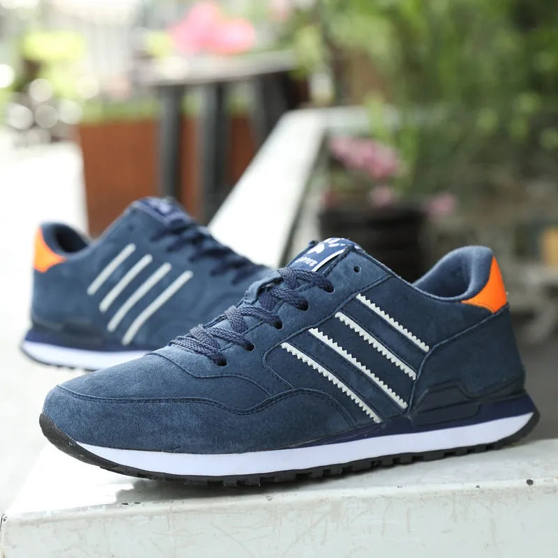 Blue leather sneakers for men with low-top design, pigskin upper, and rubber sole on a plain background