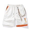 Man wearing coffee-coloured loose-fit bamboo fibre sports shorts with a straight leg and cropped length.
