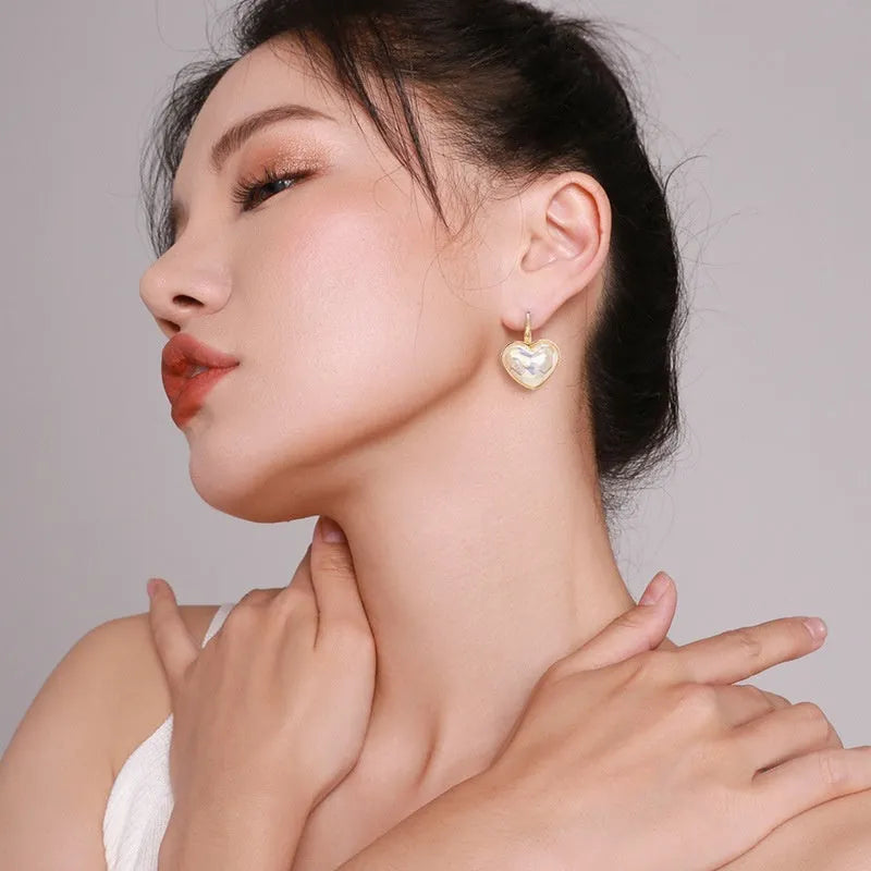 Gold coloured alloy women's ear clip with natural style and metal decorative elements.