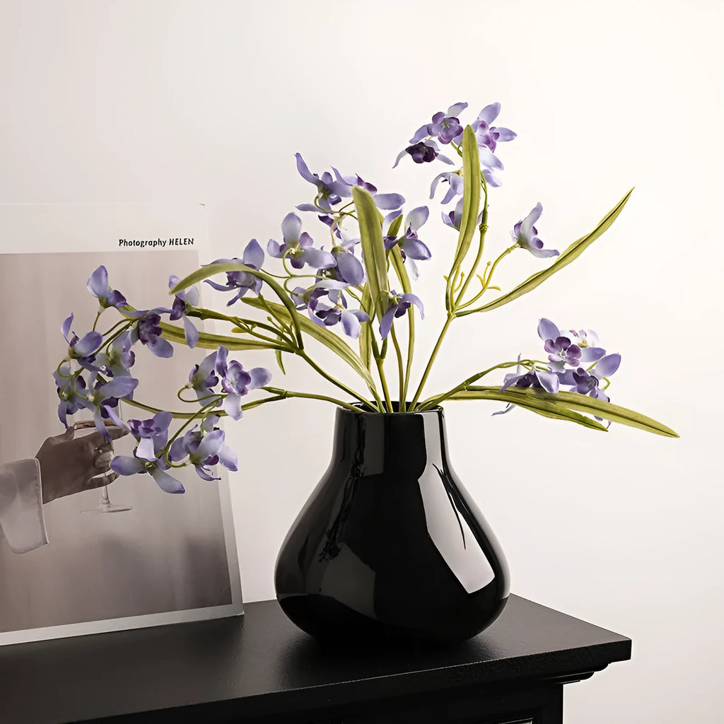 Ceramic decorative vase with orchid flowers in modern simplicity style