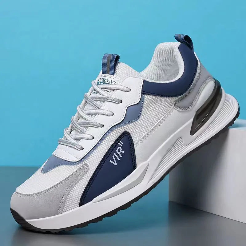 Men's colour block mesh sneakers in black, grey, and white with round toe and flat heel.
