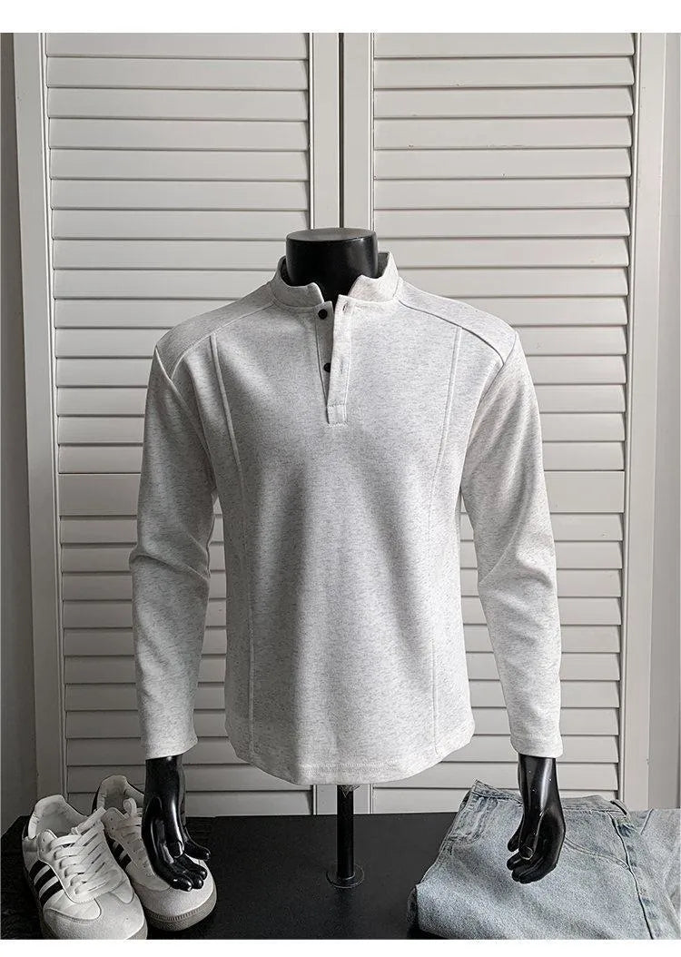 Men's grey asymmetrical stand-up collar cotton polo shirt with patchwork shoulder detail.