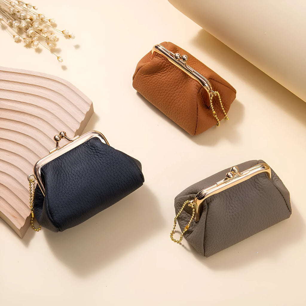 Genuine leather mini coin wallet in solid colour with visible sewing thread detail, first layer cowhide construction