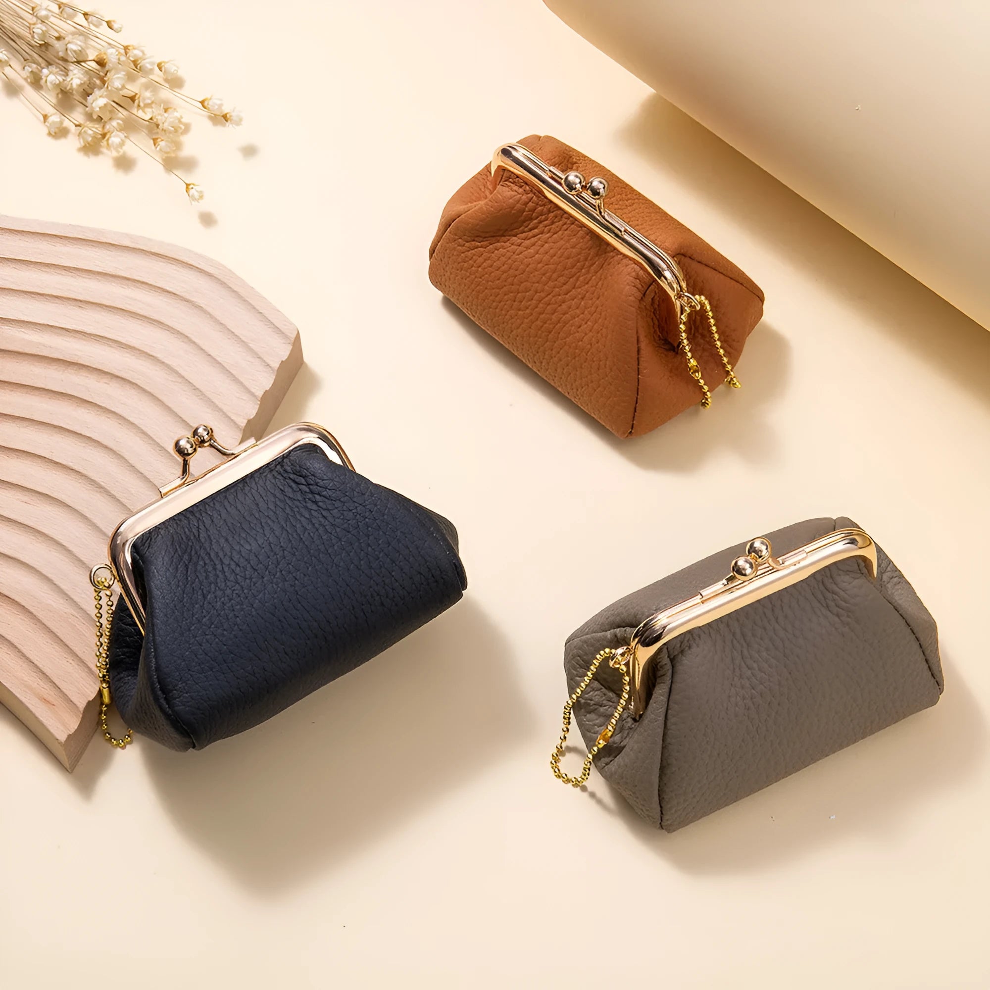 Genuine leather mini coin wallet in solid colour with visible sewing thread detail, first layer cowhide construction