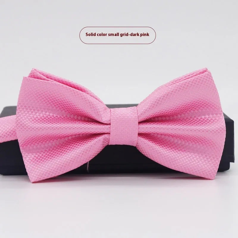 Solid colour flat head bow tie for formal wear in multiple colours including black, red, and blue.