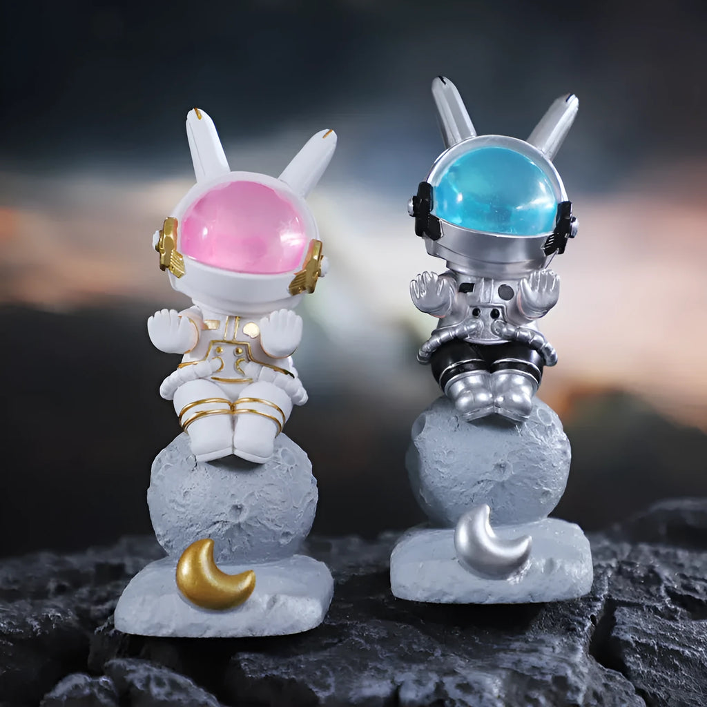 Space rabbit resin mobile phone stand in pink for desktop use
