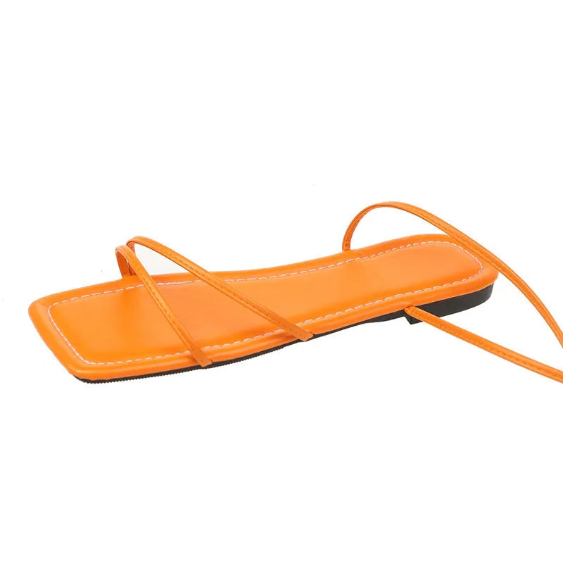 Women's white ankle ring bandage cloth flat sandals with front lace-up and square toe on a rubber sole.