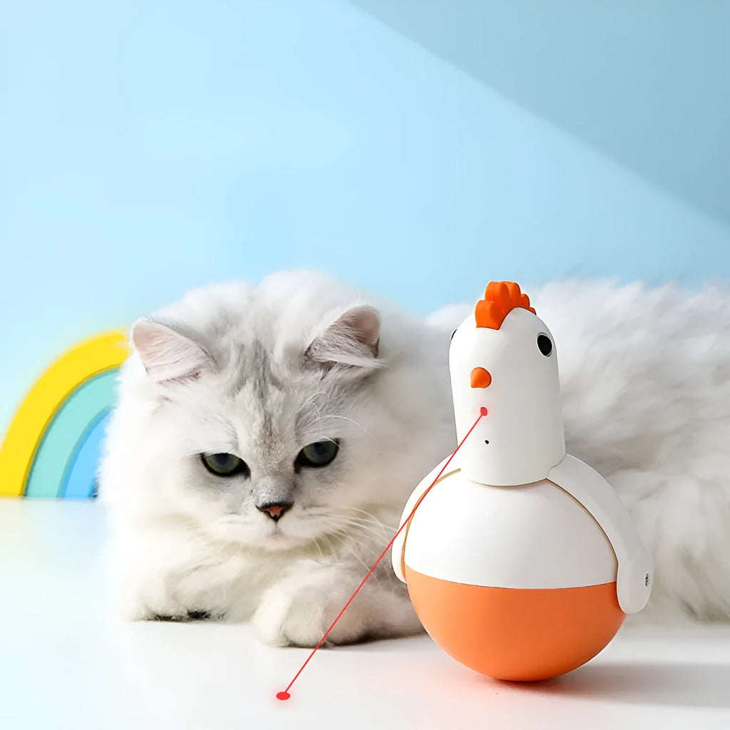 Green and orange electric cat toy chicken with laser light and sound features on a floor