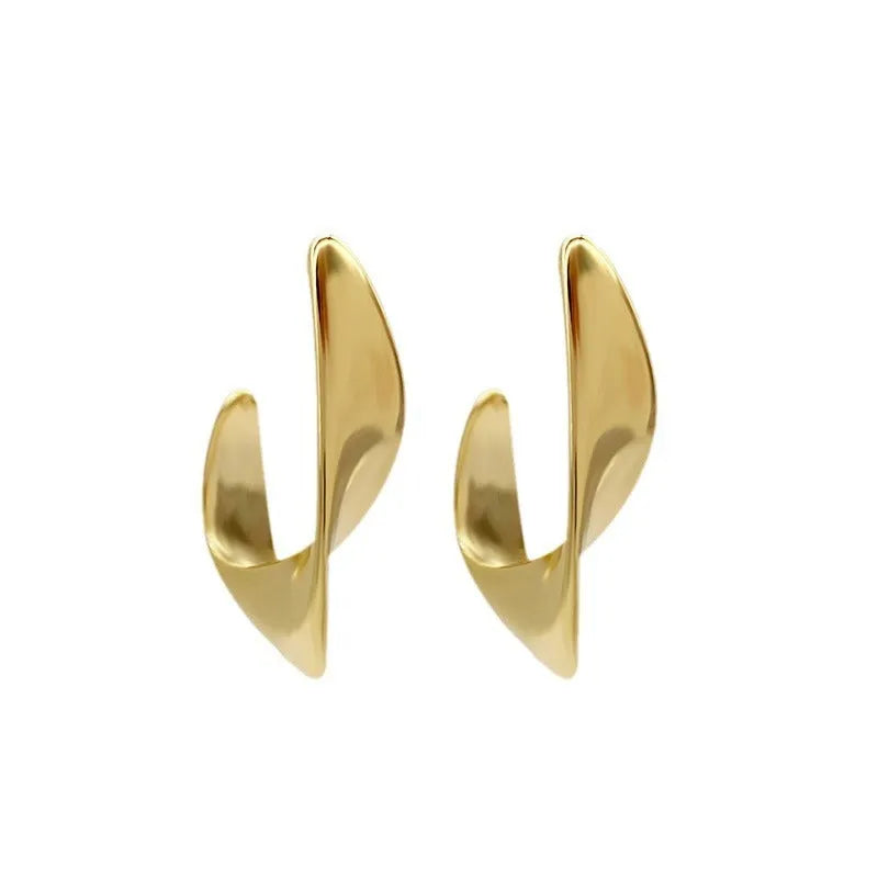 Twisted geometric metal hoop earrings in gold and silver electroplated colour options