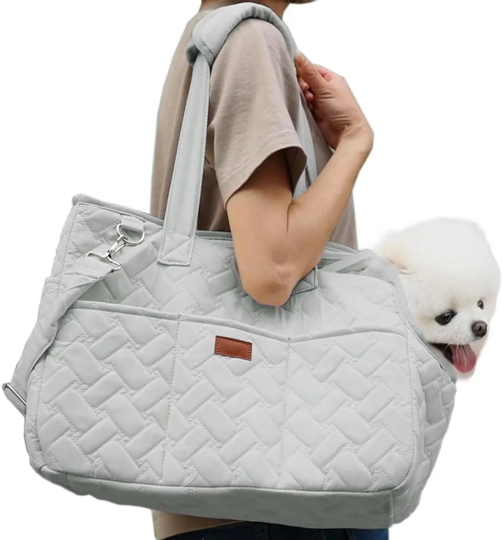 Grey pet carrier handbag with mesh side panels and multiple pockets for a small dog